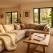Cozy living room with a large ivory chunky knit blanket draped over a beige sofa during golden hour