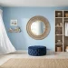 A wide coastal dressing room featuring breezy blue walls, rattan accents, and light oak floors bathed in sunlight.