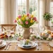 Bright and beautiful Easter brunch tablescape featuring pastel linens and fresh tulips on a wooden table.