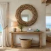 Large DIY driftwood mirror above an oak console table in a bright coastal living room