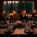 Scandi-Noir Thanksgiving tablescape featuring matte black ceramics, dark linens, and glowing beeswax candles in a moody dining room.