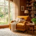 Wide view of a cozy reading nook featuring a mustard yellow armchair, wooden bookshelf, and warm sunlight filtering through sheer curtains.