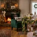 Festive bar cart decorated with crystal glassware, pine garlands, and holiday lights in a cozy living room