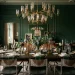 Luxurious green dining room decorated with sparkling brass, copper, and silver metallic accents