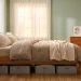Modern bedroom showing stylish under-bed storage containers keeping seasonal clothes organized.