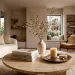 Luxurious living room featuring a perfectly styled travertine coffee table with books and brass accents