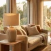 A beige ribbed ceramic table lamp illuminating a cozy living room with soft, organic textures and neutral decor.