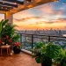 Lush tropical balcony garden with rattan furniture, large green plants, string lights, and city view at sunset
