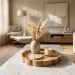 Wide view of a modern living room featuring a decorative wooden scalloped tray on a coffee table.