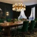 Luxurious dining room featuring a stunning tiered brass and glass Art Deco chandelier