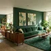 Deep forest green living room interior design with natural wood and vibrant plants for 2026 decor.