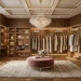 Luxurious modern dream dressing room featuring warm metallic gold accents, a vanity, and organized closets