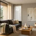 Minimalist living room featuring a beautifully styled Christmas tree with sparse silver tinsel and soft lighting.