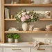 Beautifully styled open kitchen shelving decorated for Mother's Day with pink peonies and stoneware.