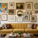 Beautifully styled gallery wall in a small apartment living room above a mustard sofa