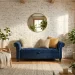 Navy blue velvet tufted storage bench in a bright modern small living room