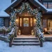 Beautiful winter porch decorated with icy blue and silver garlands, ornaments, and cool-white lights