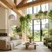 Cascading pothos plants hanging from high ceilings in a bright, modern living room.