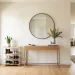 Modern clutter-free entryway featuring a sleek narrow console table and neatly organized shoe rack.
