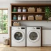 Beautiful DIY open shelving in a modern laundry room styled with glass jars and woven baskets