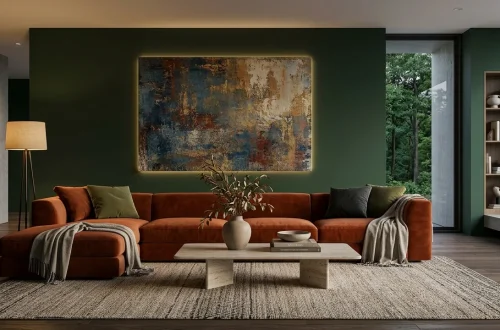 Modern living room featuring a textured abstract canvas on a dark forest green wall with warm ambient lighting.