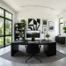 High-contrast black and white home office featuring a sleek dark desk and minimalist decor.