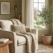 A cozy bedroom reading nook featuring a plush armchair, chunky knit blanket, side table with coffee, and natural window light.