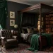 Luxurious dark academia bedroom featuring stunning emerald green velvet curtains, dark walls, and vintage decor.