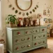 Sage green nursery dresser with cute mushroom shaped hardware knobs in a woodland themed room