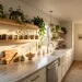 A modern renter kitchen upgraded with beautiful peel-and-stick geometric backsplash tiles and warm wood counters.